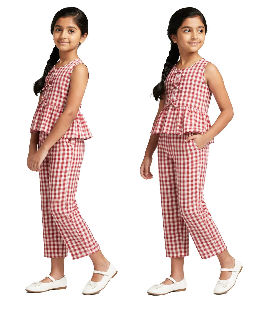 Girl wearing a sleeveless red and white gingham co-ord set with cropped pants and white shoes