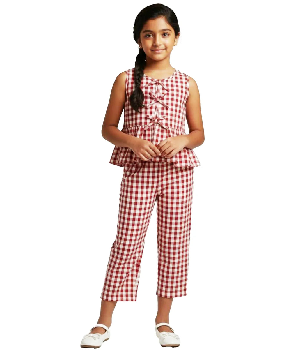 Girl wearing sleeveless red and white gingham co-ord set with cropped pants