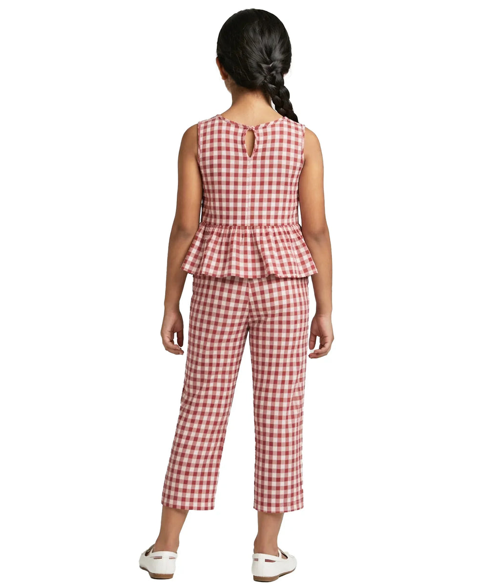 Girl wearing red and white gingham sleeveless peplum top and matching pants set